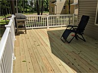 <b>Pressure Treated Deck with White Washington Vinyl Railing</b>